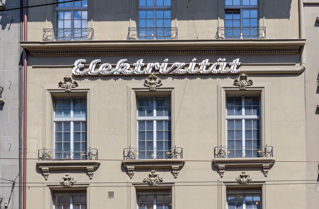 My new office in the building with Bern's oldest illuminated sign!